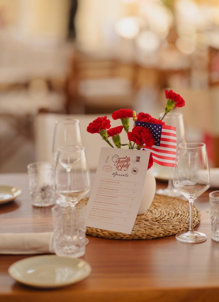Fourth of July menu and decorations placed in the center of a dining table