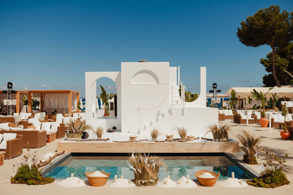 White staged, platformed area by a plunge pool in Nikki Beach Mallorca