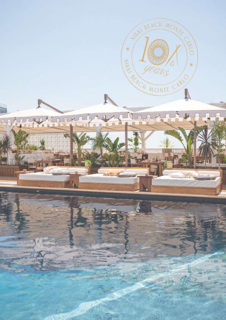 Nikki Beach Monte Carlo 10 year anniversary badge over a pool photo