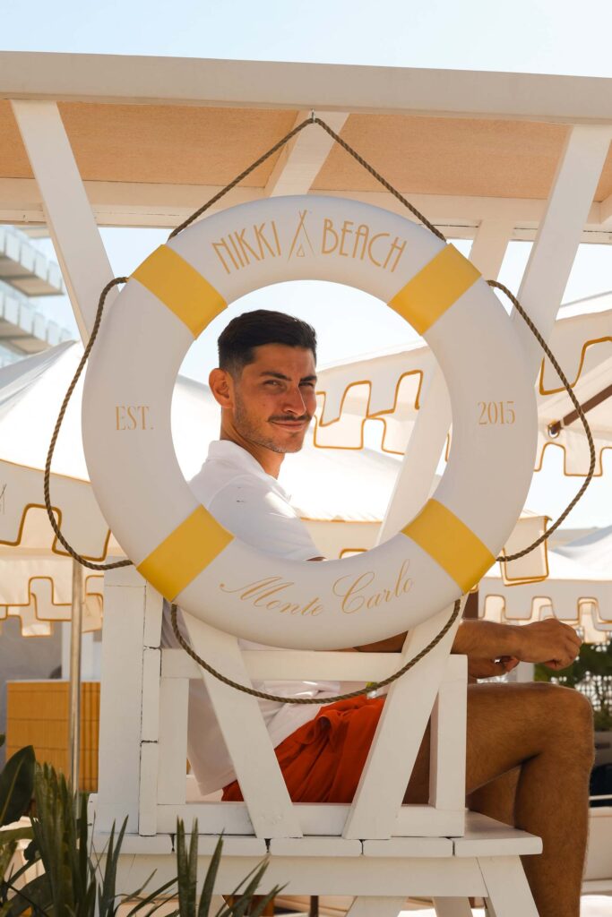 Our lifeguard stands watch beneath the iconic yellow and white of Nikki Beach Monte Carlo — the ultimate symbol of Riviera elegance since 2015