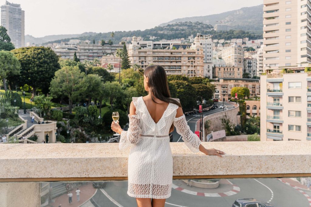 Women standing on the balcony watching the Grand Prix