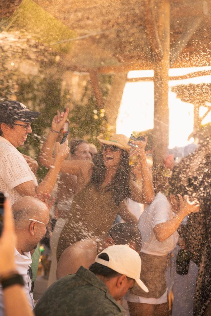 A crowd of Nikki beach guests dancing and enjoying themselves